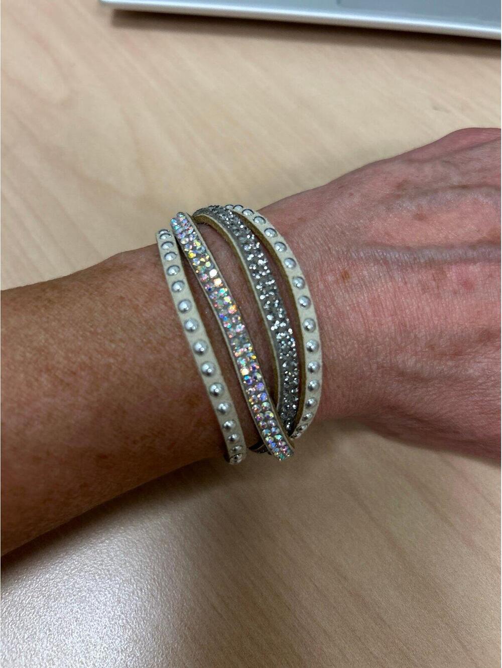 White suede Bracelet decorated with silver rhinestones and a rainbow Sheen.